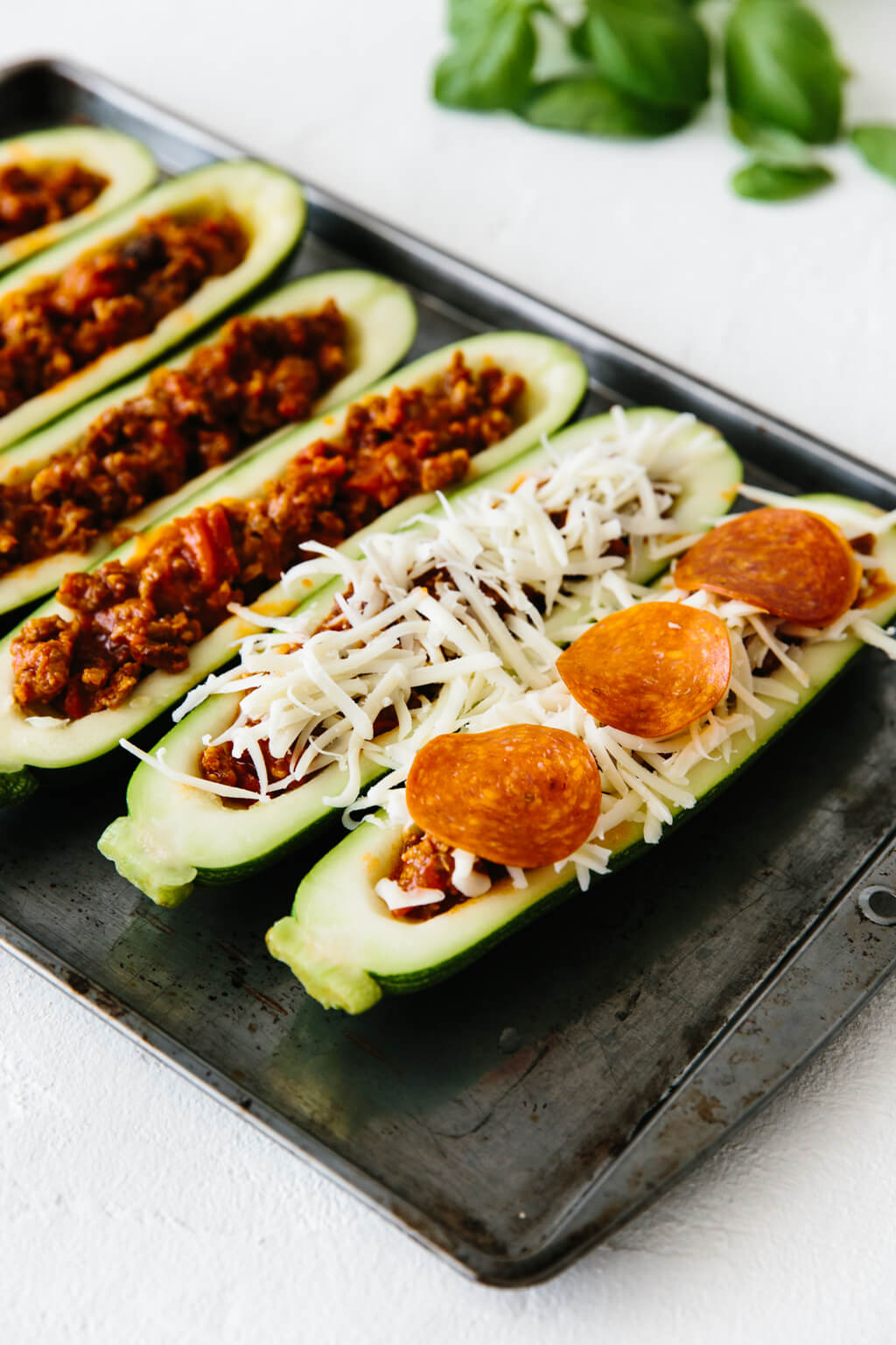 Zucchini halves stuffed with Italian sausage, mozzarella and pepperoni.